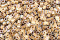 TOHO Rainbow Crystal (with Gold Lining Cube 1.5mm Seed Bead