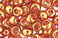 TOHO Gold Lustered Transparent Pink Round 6/0 Seed Bead