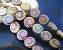 Czech Glass Laser Etched Spiral Ammonite on White w/ Metallic Rainbow Finish Coin 14mm
