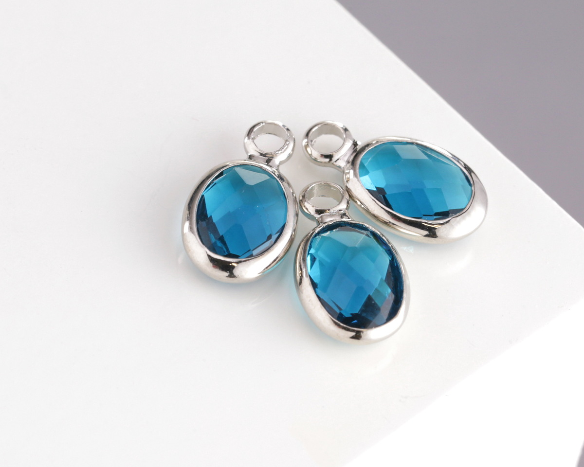 Pacific Blue Crystal Oval Drop in Silver Finish Bezel 6x8mm